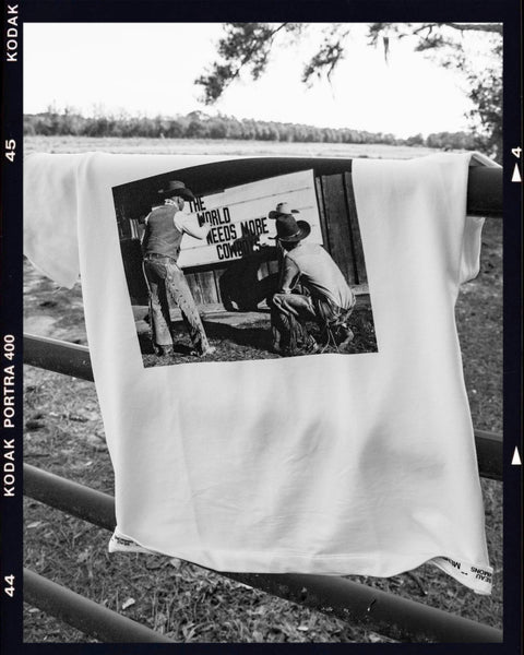 The World Needs More Cowboys | Premium Gallery Tee
